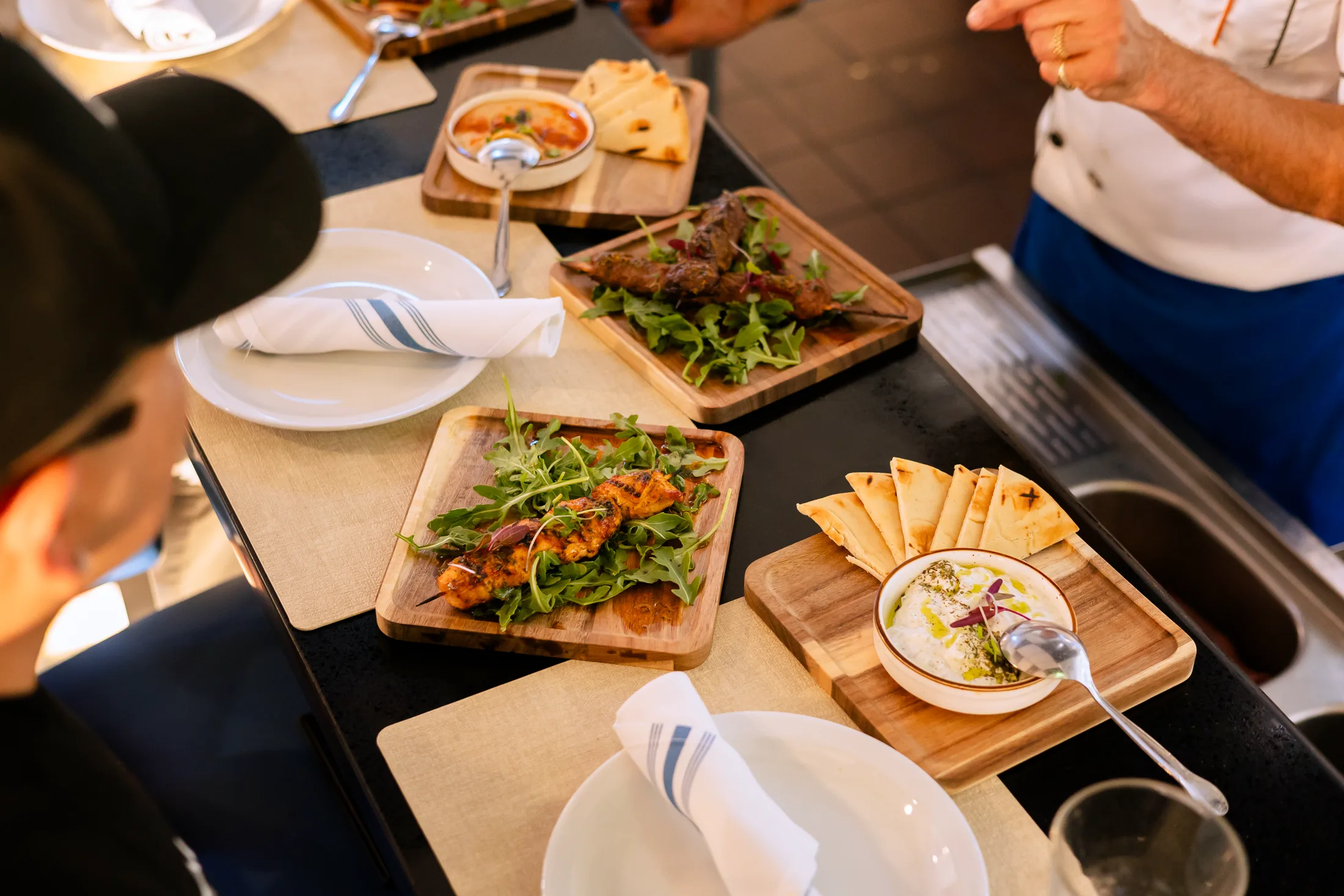 Shareable plates: grilled skewers, hummus and fresh pita